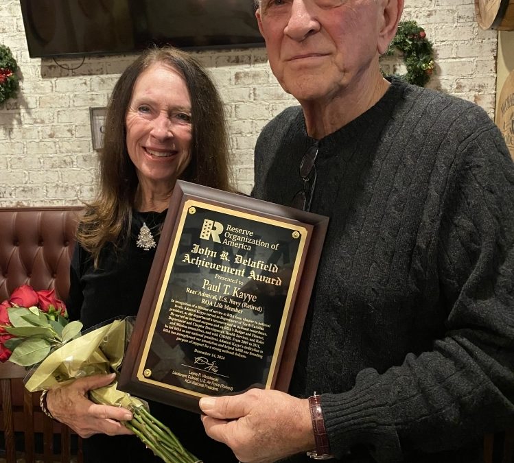 Rear Adm. Paul T. Kayye recognized during Christmas luncheon