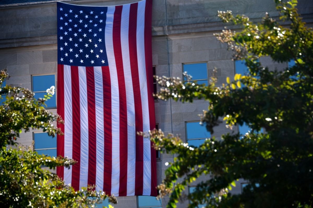 American flag hung from the side of the Pentagon